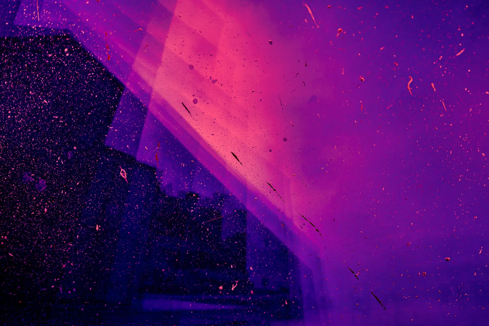 An abstract composition of vibrant purple and pink hues featuring speckled patterns and a diagonal beam of light.